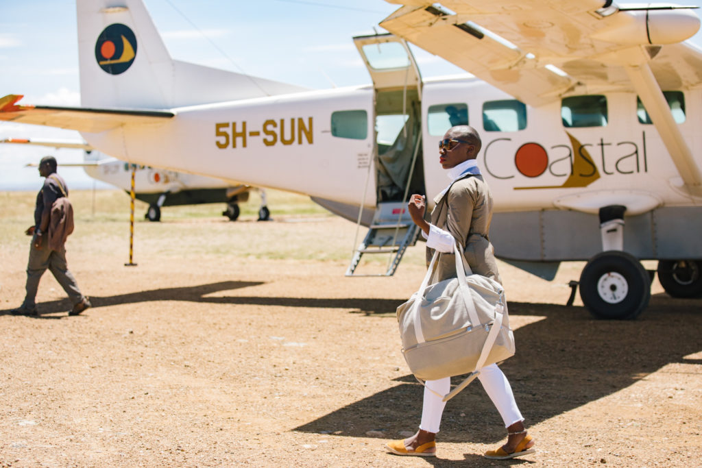 Jessica Nabongo Walking from an airplane in Serengeti, Tanzania